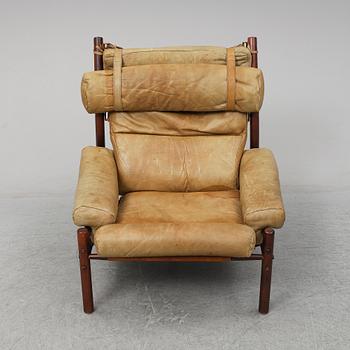 AN ARNE NORELL "INCA" LOUNGE CHAIR.