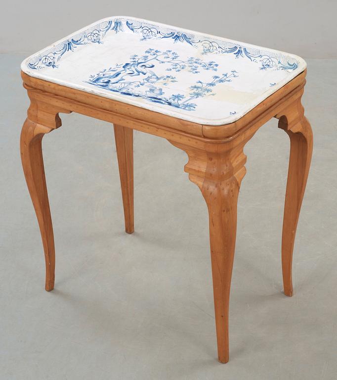A Swedish Rococo faience tea table Rörstrand 1757.