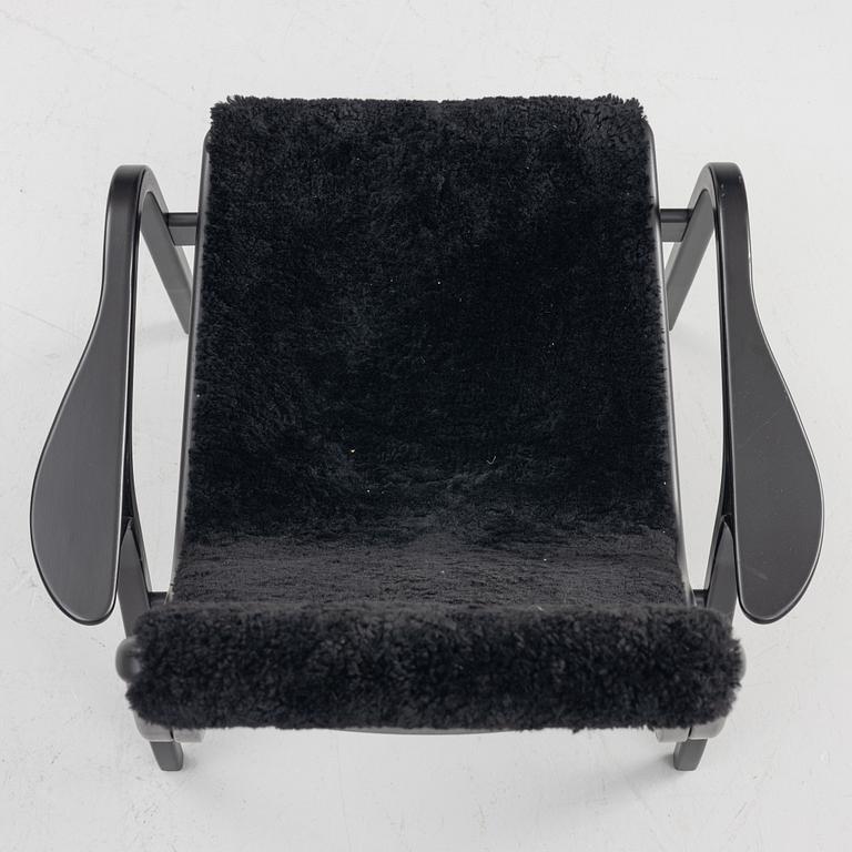Yngve Ekström, a 'Lamino' easy chair with footstool, Swedese, 2018.