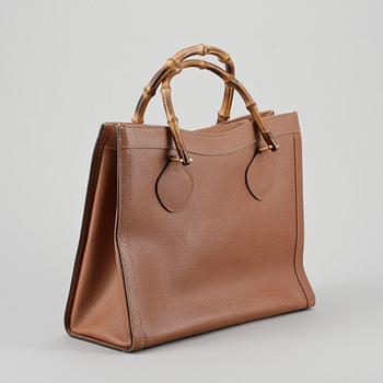 GUCCI, a brown leather imitaion handbag with bamboo handles.