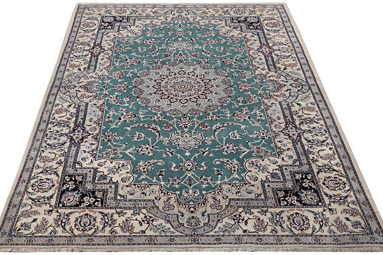 A Nain carpet, part silk, 6 laa, ca. 300 x 201 cm.