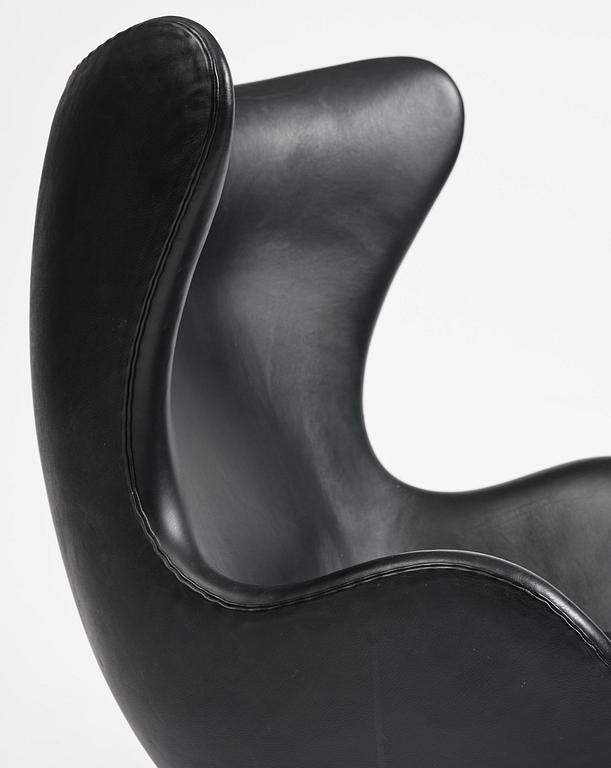 Arne Jacobsen, an "Egg" chair with ottoman, Fritz Hansen, Denmark, 2001.
