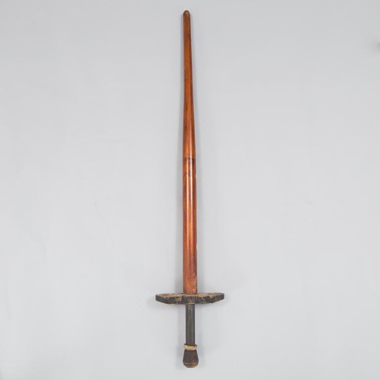 A 20th century wood pogo stick.