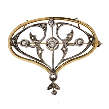 An Art Nouveau Pendant/Brooch in 18K gold, silver and diamonds.