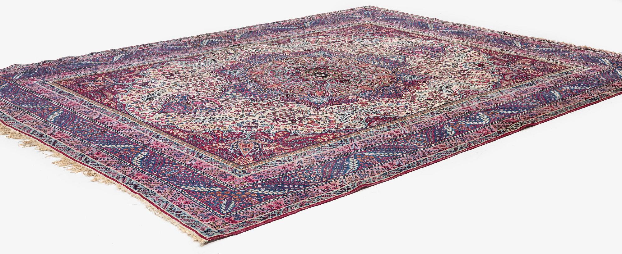 A semi-antique Kirman carpet, South Persia, c. 380 x 289 cm.