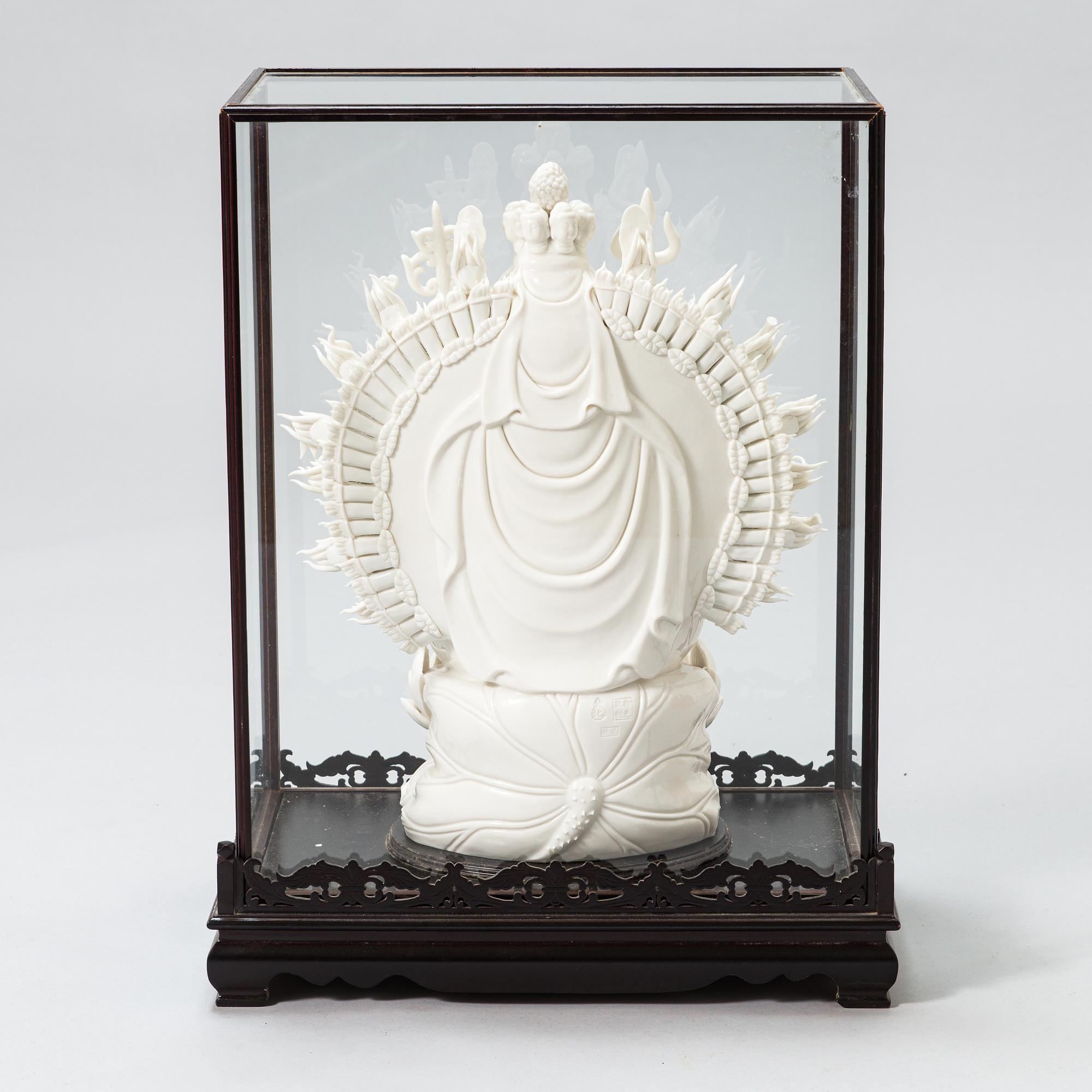 An oriental Buddha statue in porcelain.