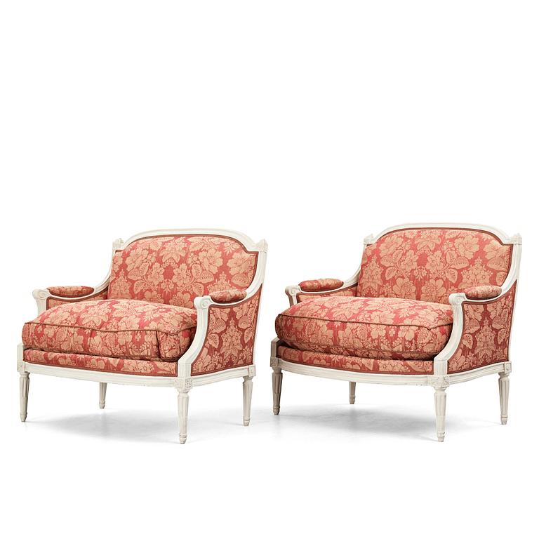 A pair of Louis XVI late 18th Century armchairs by M. dela Porte (Paris 1765-1784).