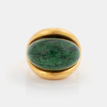 509. A Georg Jensen & Wendel ring in 18K gold set with a green and black stone.