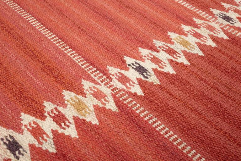 Barbro Nilsson, A CARPET, "Salerno kallröd med enkel bård", flat weave, ca 217 x 149,5 cm, signed AB MMF BN.