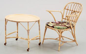 A rattan armchair and table attributed to Josef Frank, Svenskt Tenn.