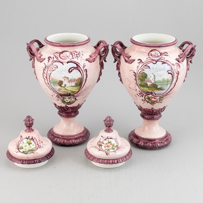 A pair of earthenware vases with covers, early 20th century.