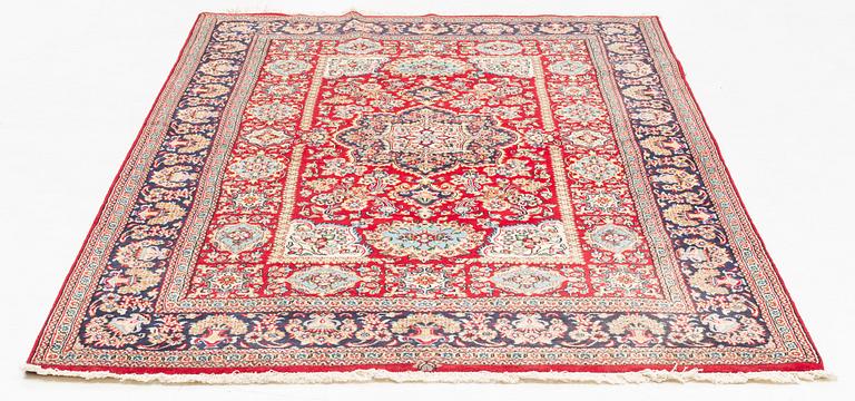 An oriental rug, c. 260 x 162 cm.