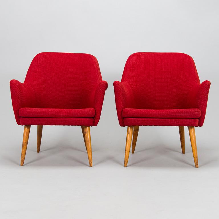 A pair of mid-20th century armchairs.