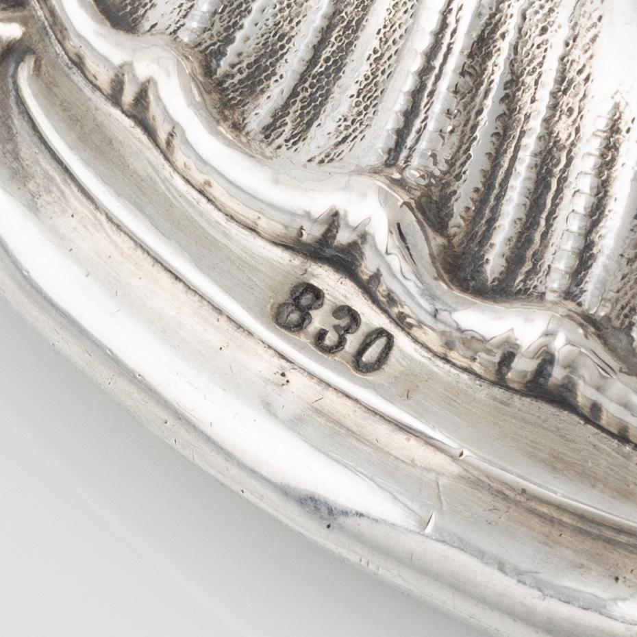 A pair of silver candle sticks by K Anderson Stockholm 1898.