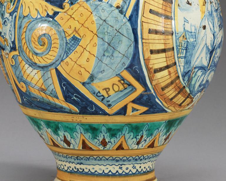 An Italian majolica albarello, presumably Urbino, 17/18th Century, marked with the date 1628.