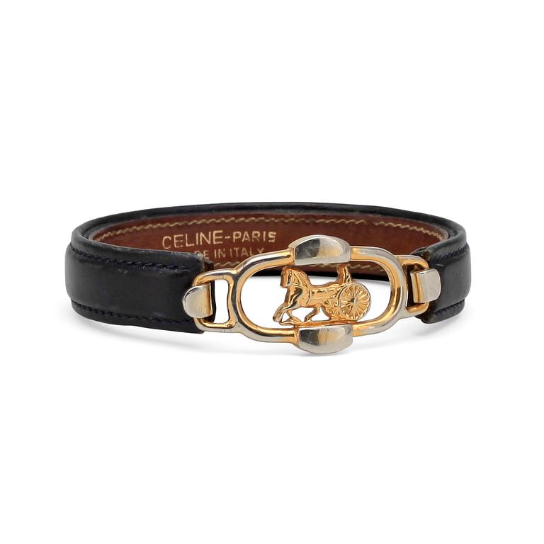 CÉLINE, a black leather bracelet.