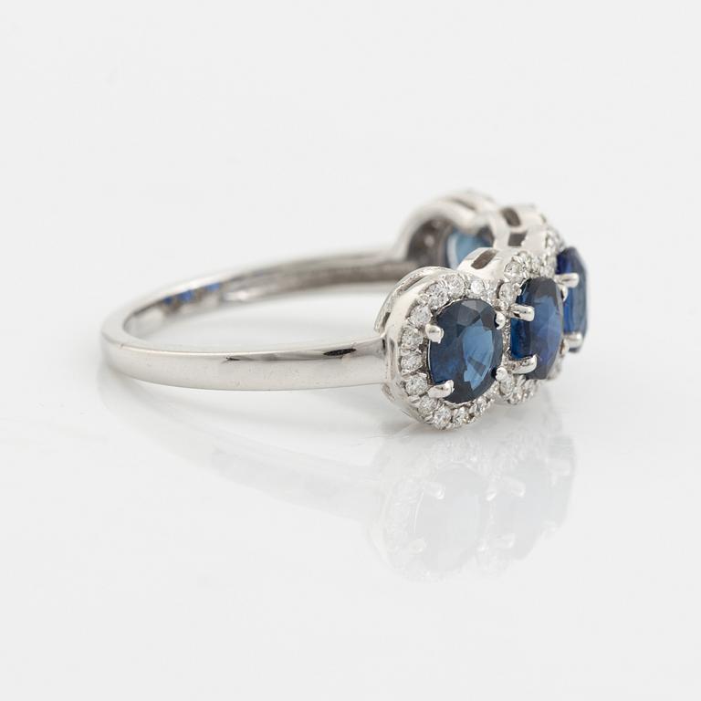 Oval sapphire and brilliant cut diamond ring.