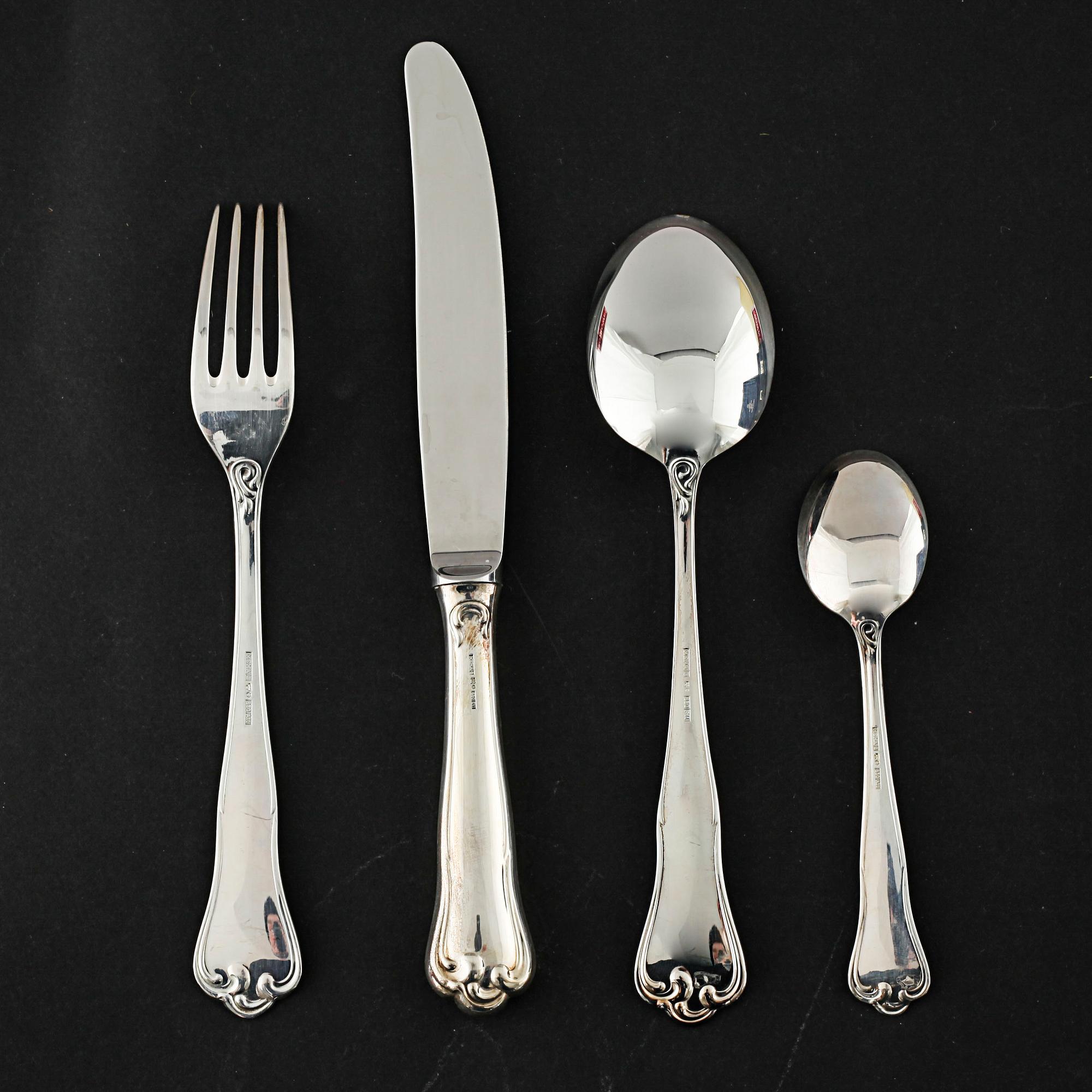 A silver set of table ware of 47 pcs by MEMA, from the late 20th century.