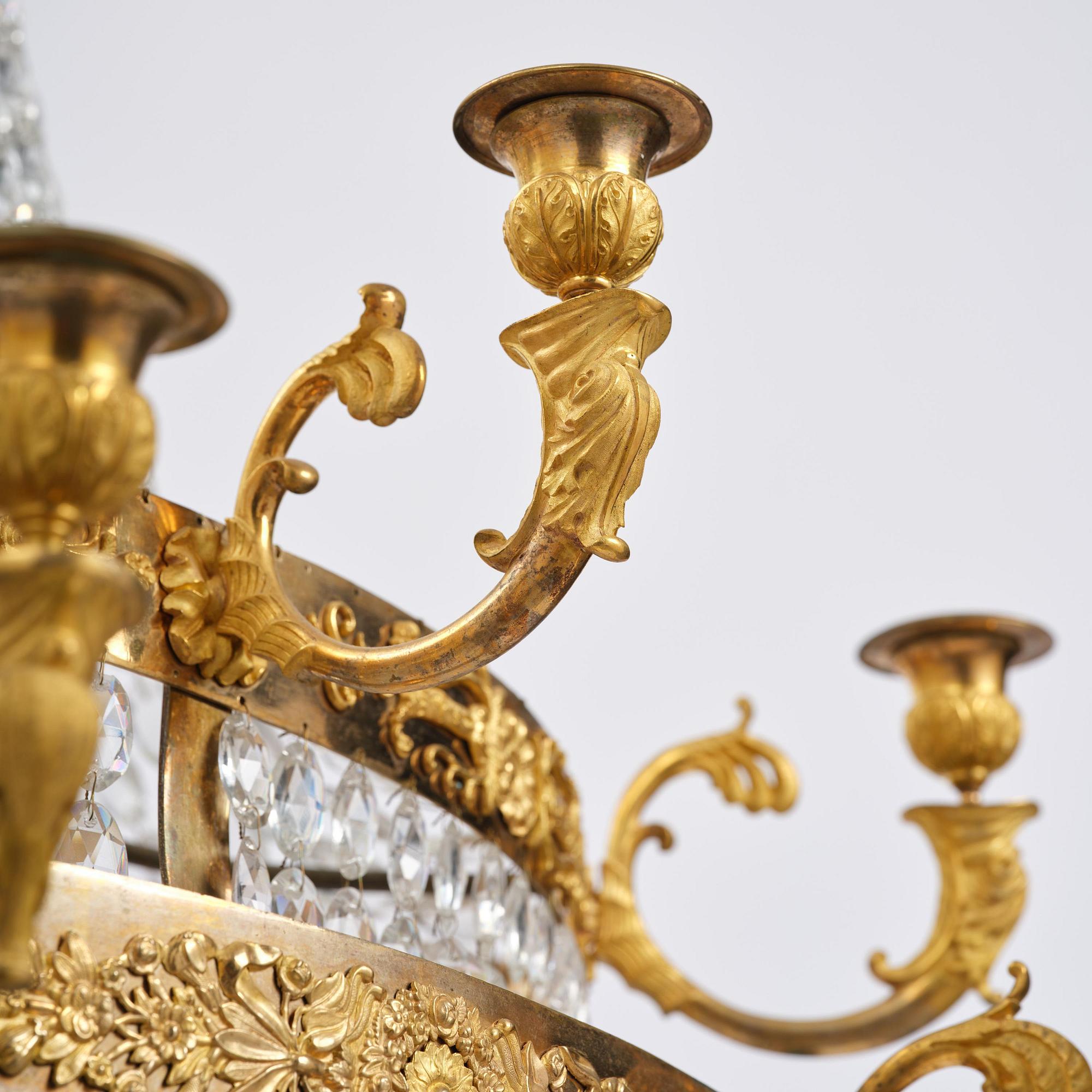 An ormolu and cut glass sixteen-branch Empire chandelier, Paris, early 19th century.