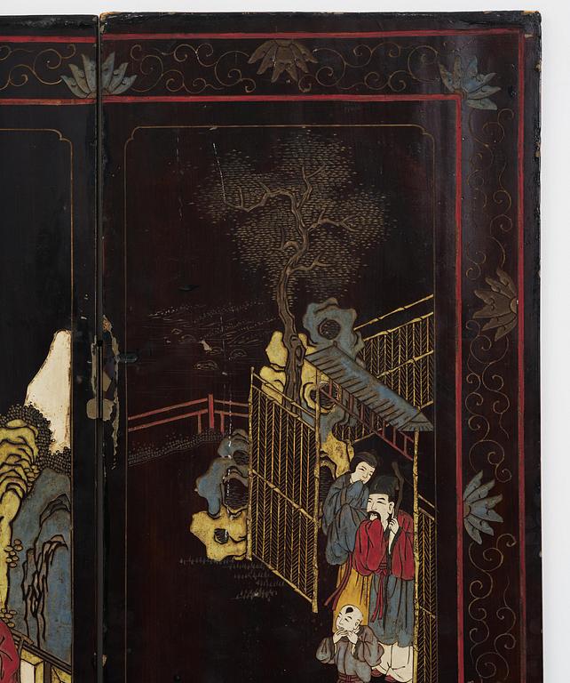 A Chinese four panel lacquer folding screen, first part of the 20th century.