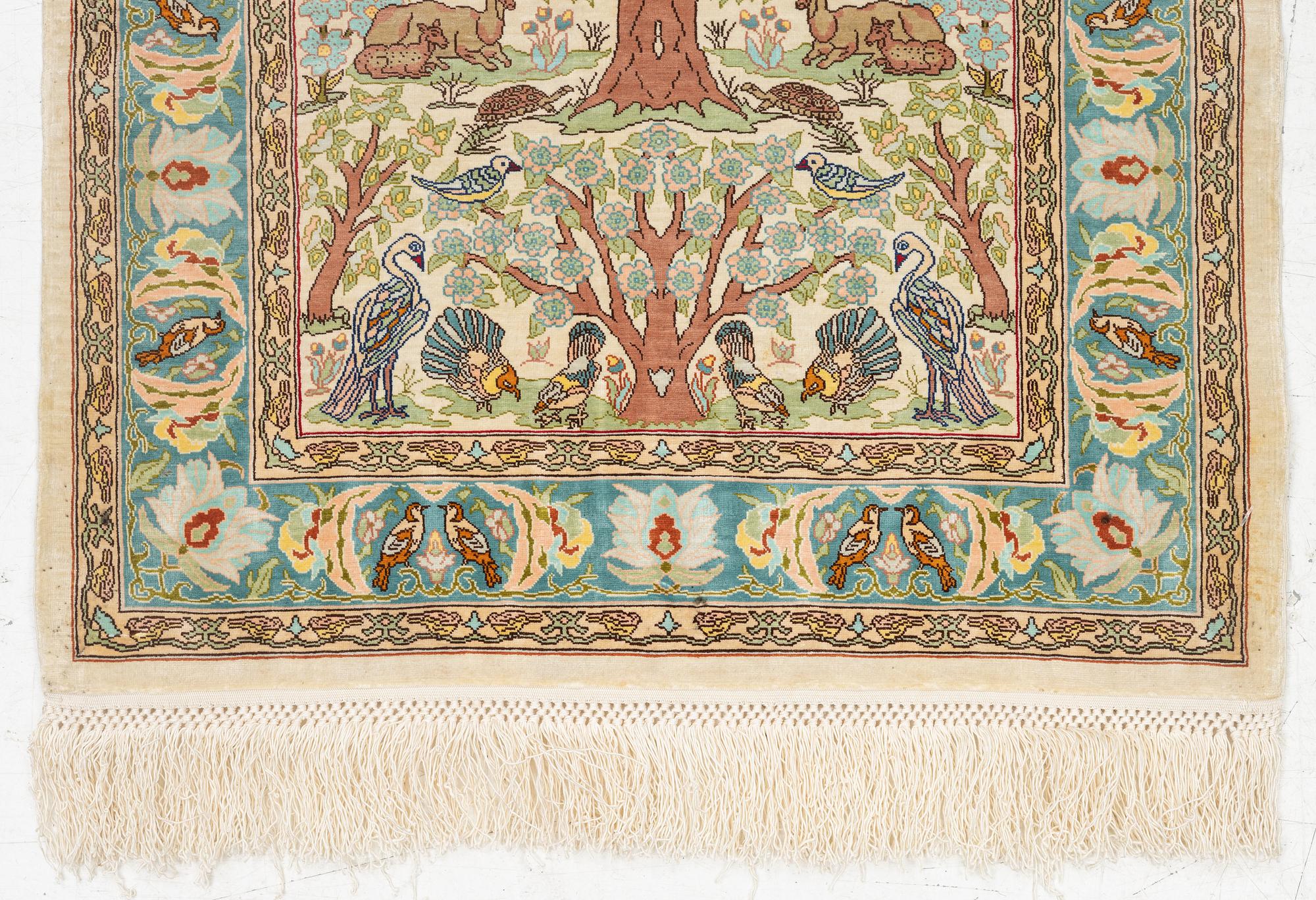 A figural silk Hereke rug, c 65 x 47 cm.