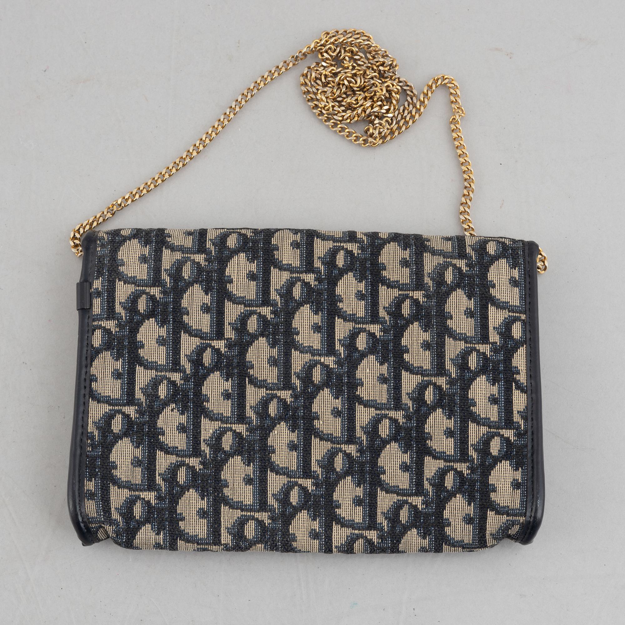 Christian Dior, a handbag/clutch.