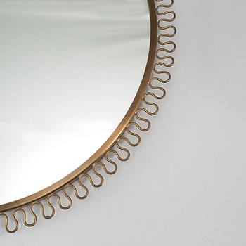 A Swedish Modern brass mirror, mid 20th century.