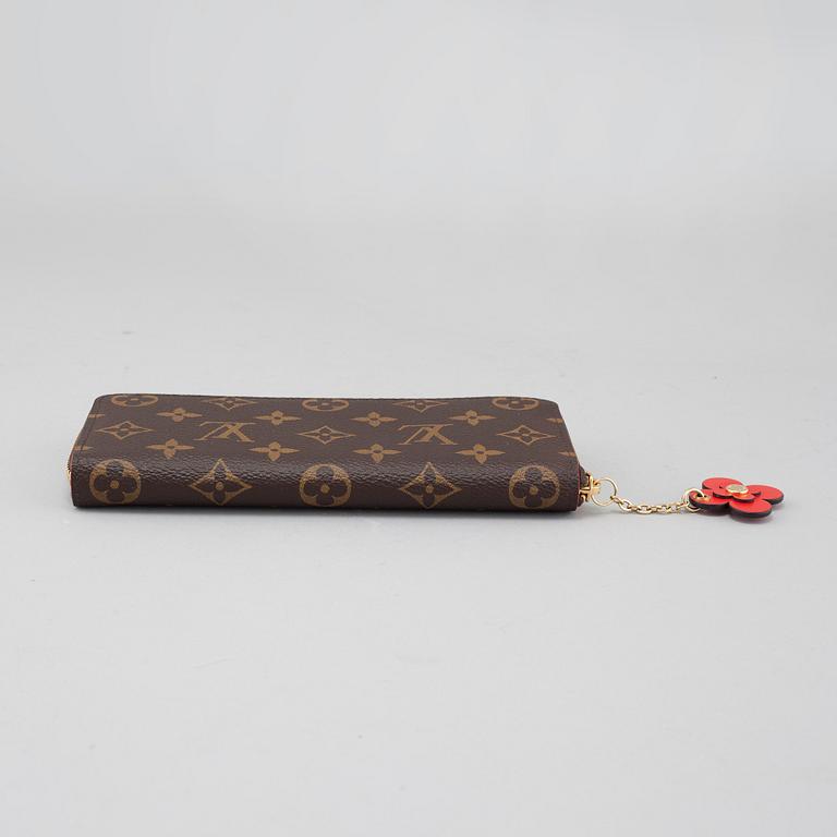 LOUIS VUITTON, a "Clémence" wallet.