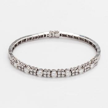 Armband, 14K vitguld med briljantslipade diamanter, Importstämplad A. Tillander 1975.
