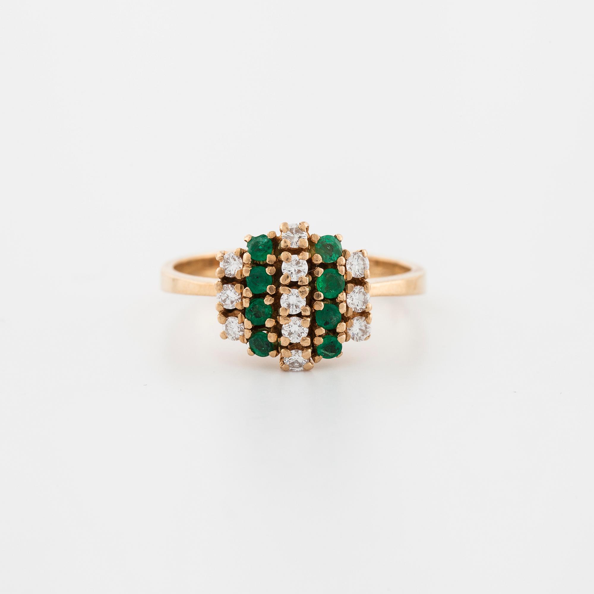 An emerald and brilliant cut diamond ring.