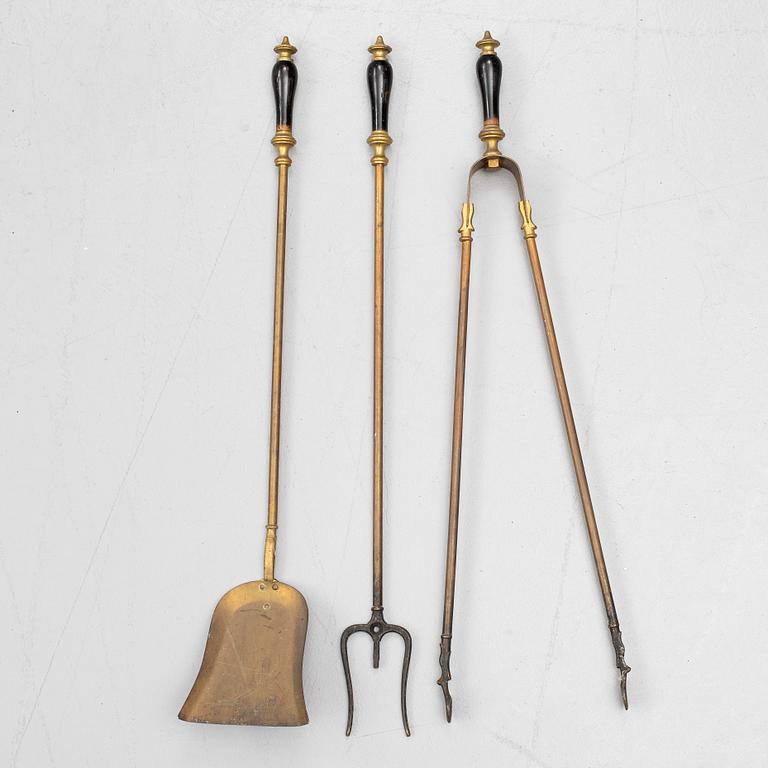 A set of three brass fire irons, 19th century.