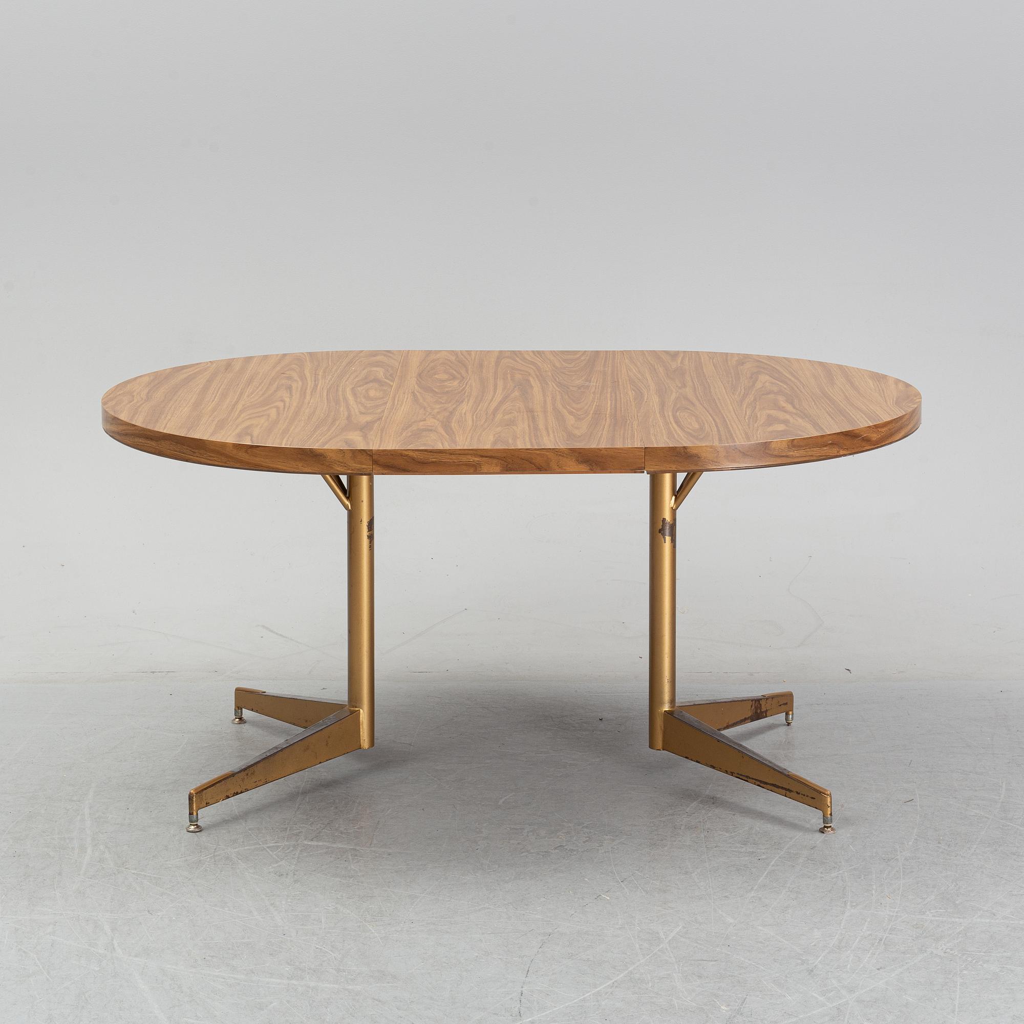 A dining table with four chairs, Walter of Wabash, table dated 1960.