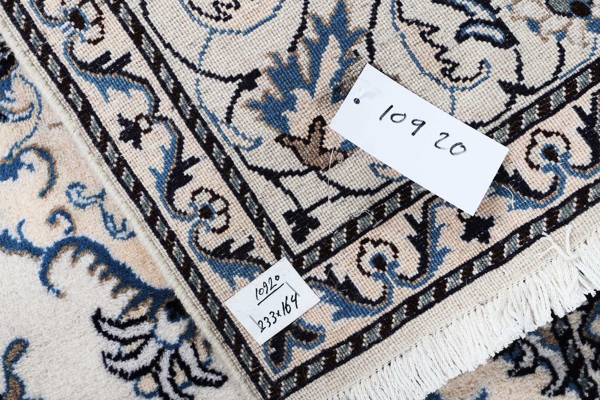 A rug, Nain, part silk, so called 9 LAA, ca 233 x 164 cm.