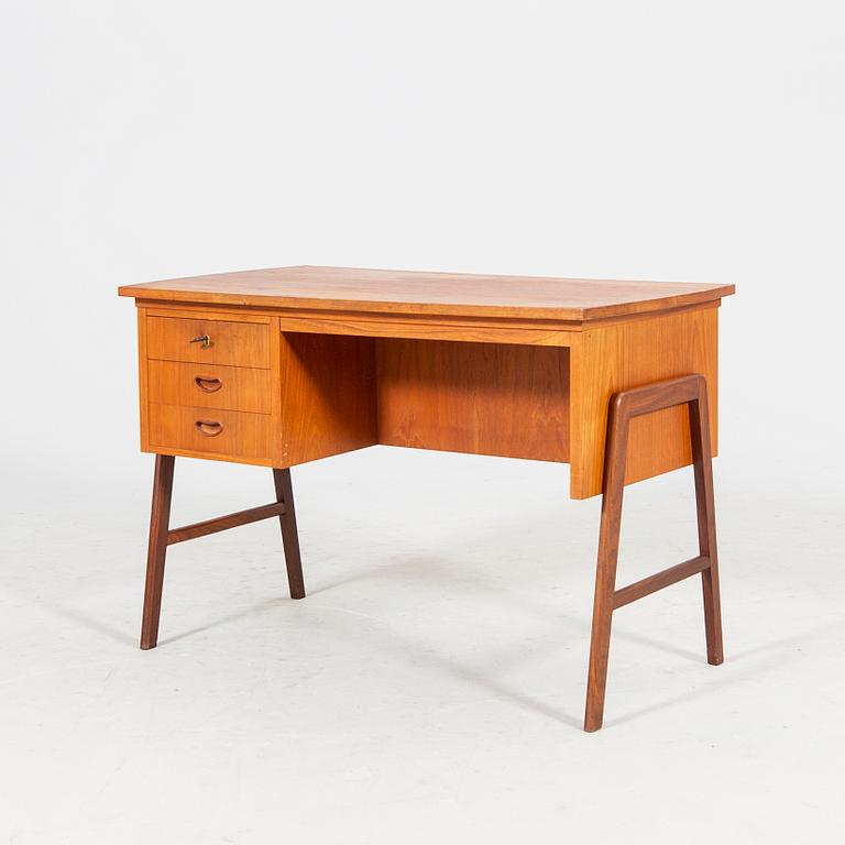 A veneered desk from the mid 1900's.