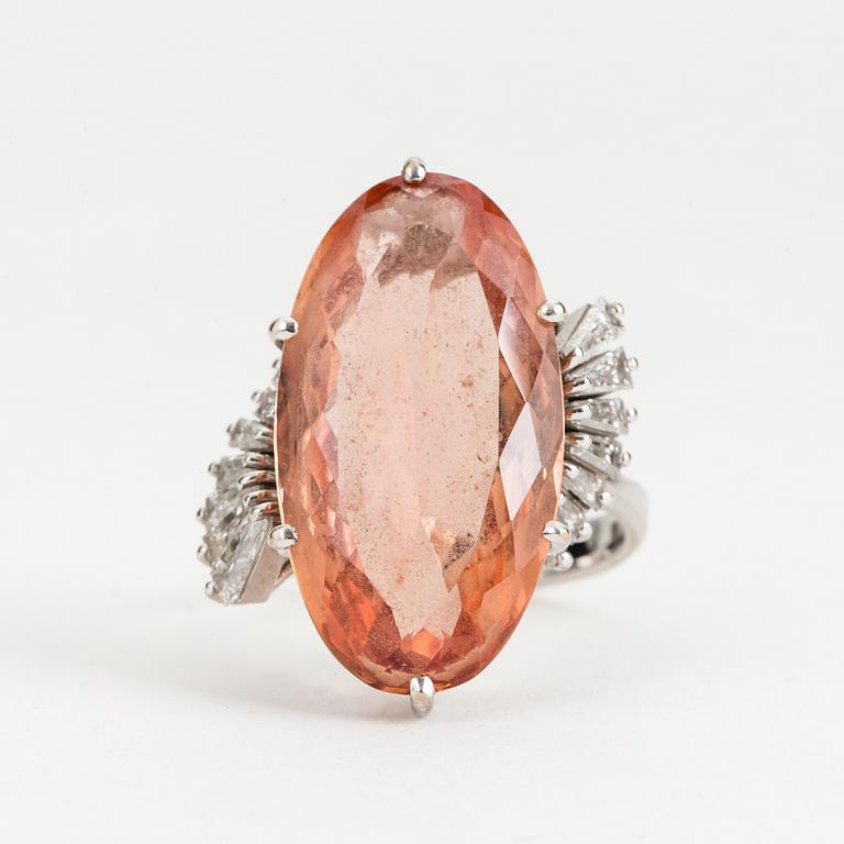 A topaz and diamond cocktail ring.