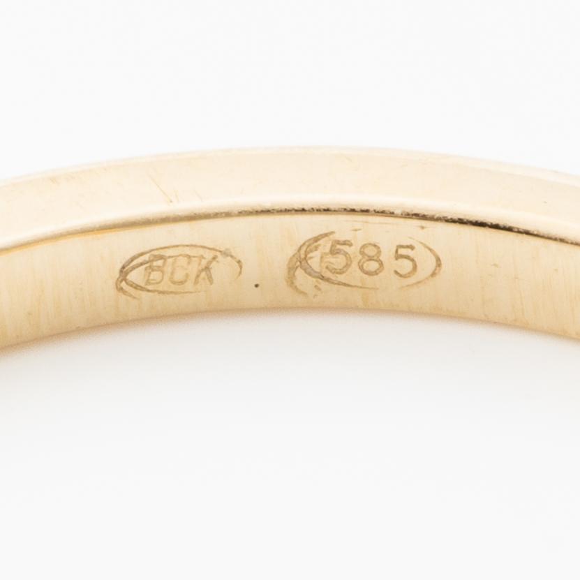 14K gold ring with marquise-cut diamonds.