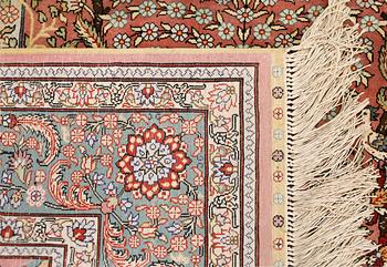 An oriental silk rug, approx. 155 x 93 cm.
