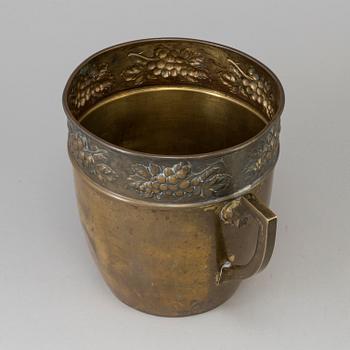 A brass jugend-style champagne cooler from early 21 st century.