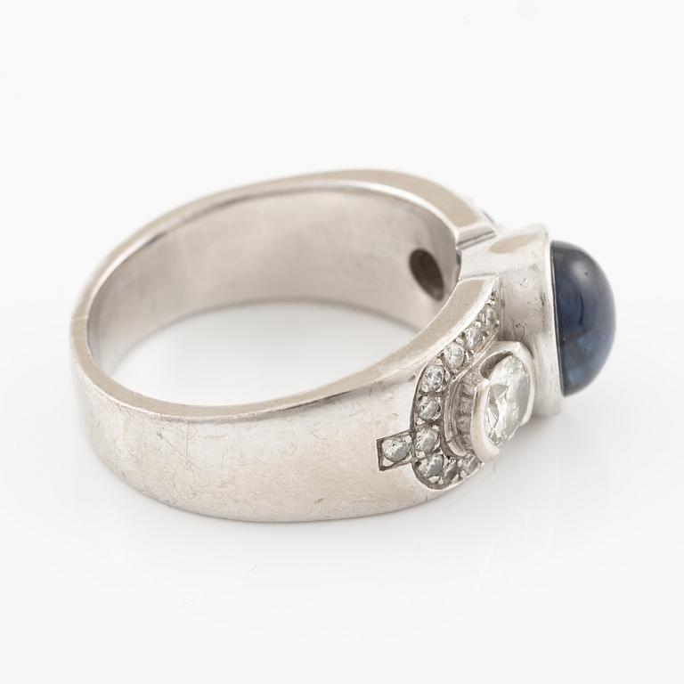 Ring in 18K white gold set with a cabochon-cut sapphire and brilliant-cut diamonds, Kenneth Magnell.