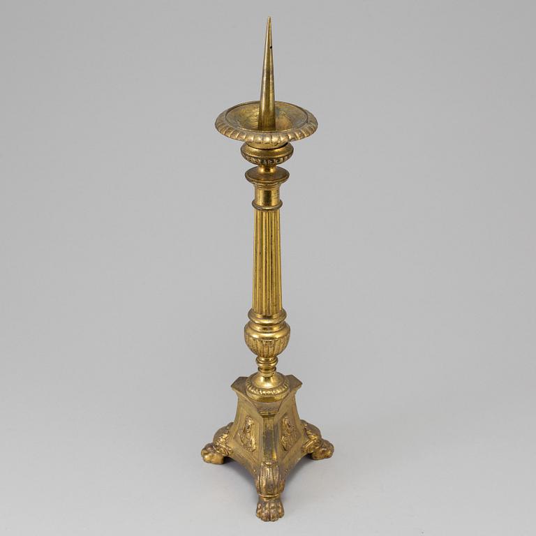 A 18th century bronze candlestick.