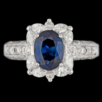 1054. A blue sapphire, tot. app. 1.30 cts, and brilliant cut diamond ring, tot. app. 1 ct.