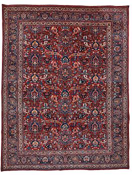 330. A CARPET, a semi-antique Mashad, ca 400-404 x 314 cm.