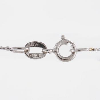 A aquamarine and briliant cut diamond pendant.