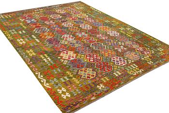An Afghan Kilim carpet, c. 357 x 266 cm.