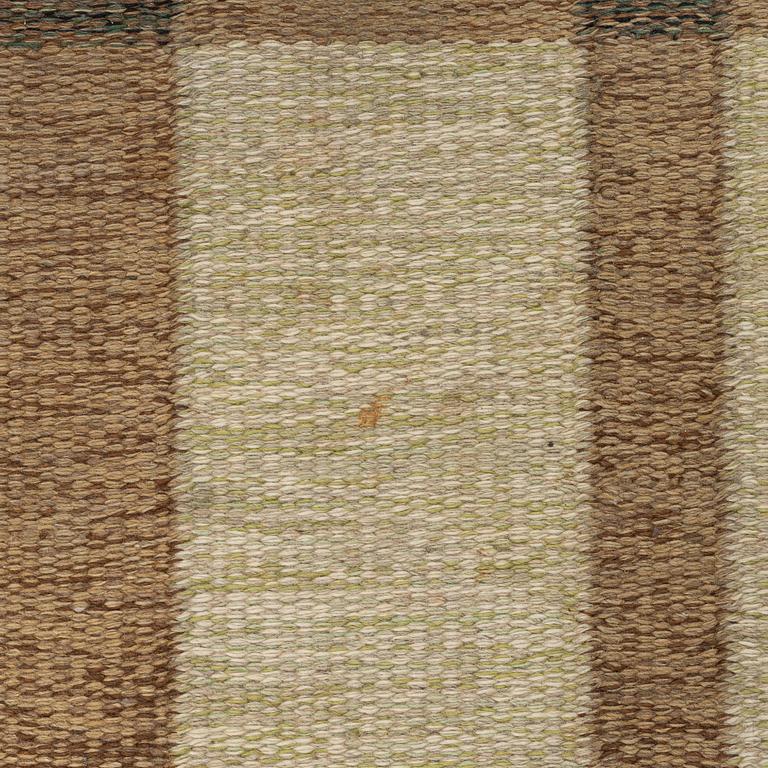 A flat weave carpet, signed, ca. 243 x 165 cm.