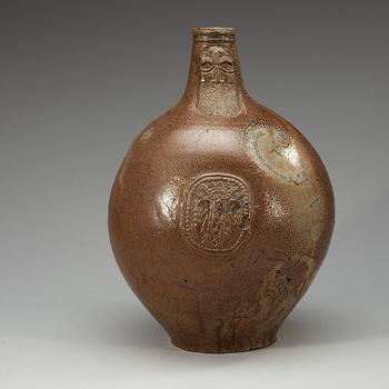 A large salt-glazed stoneware 'Bartman jug', 17th Century.