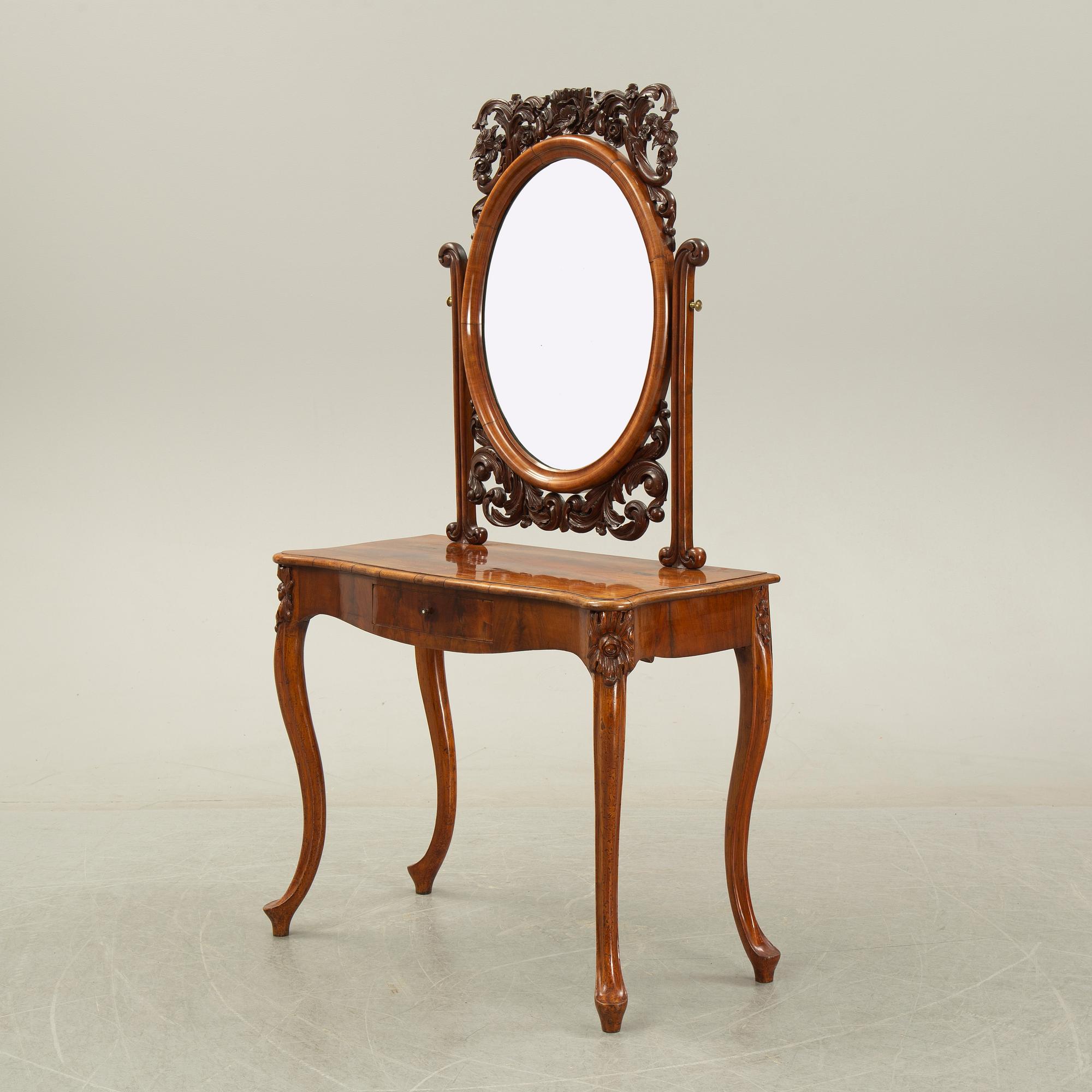 A rococo style dressing table, 19th Century.