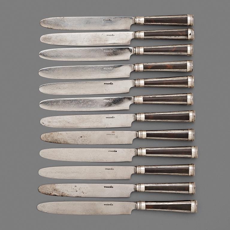 A set of twelve Swedish early 19th century turtle and silver dinner-knifes.