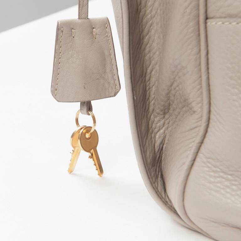 A leather handbag by Prada.