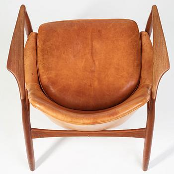 Ib Kofod-Larsen, a "Seal" teak and brown leather armchair, Olof Persson Möbler, Jönköping, Sweden 1950-60's.